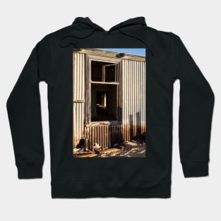 Window in the iron building. Hoodie